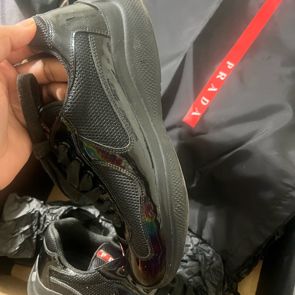 Patent leather black Prada’s size 7